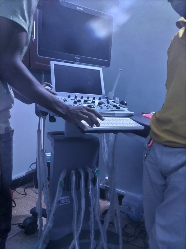 Pasha team working on an ultrasound machine during biomedical equipment service