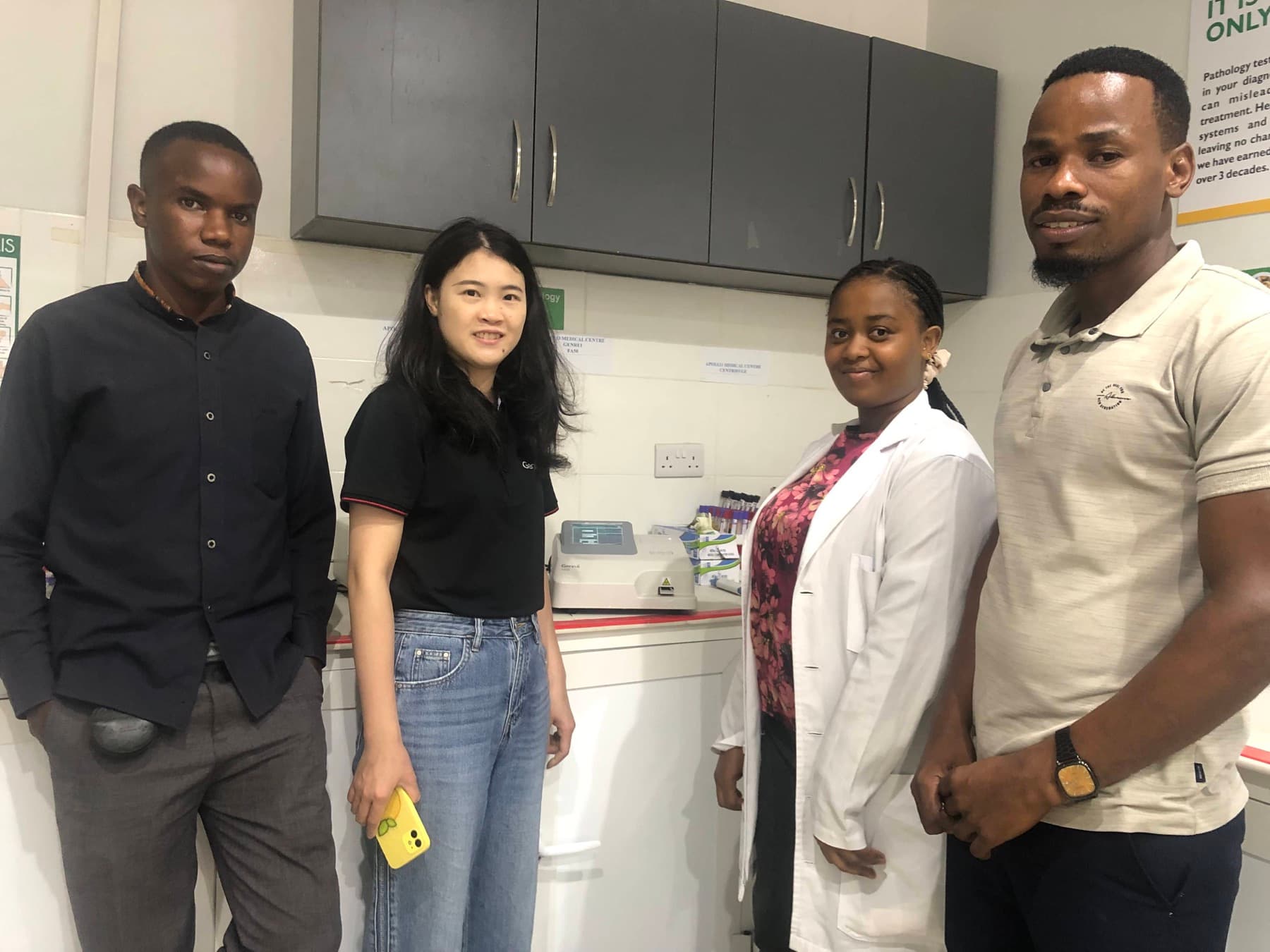 Technical team and partner representatives in a hospital laboratory